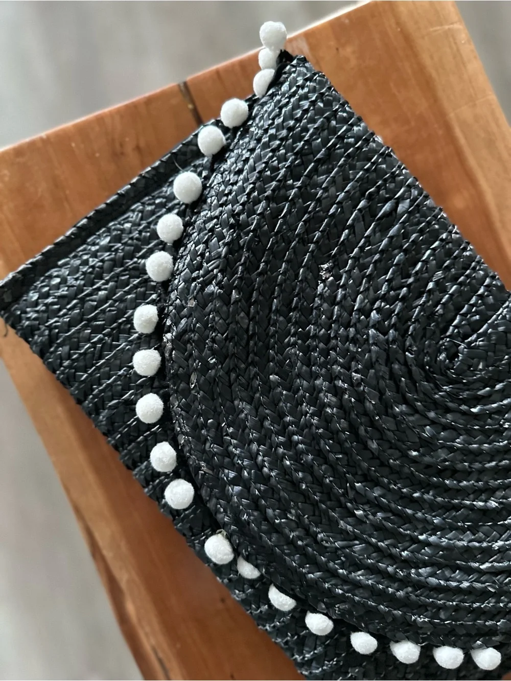 Shiraleah Navy Woven Straw Clutch with White Pom-Pom Trim